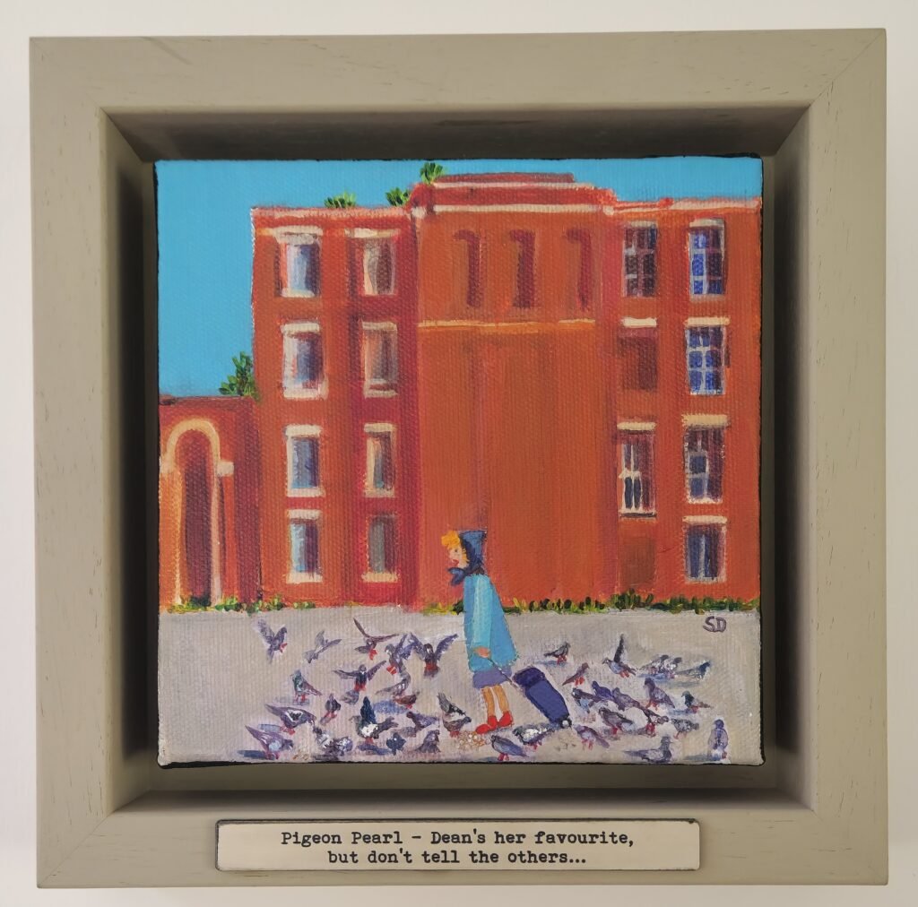 “Pigeon Pearl” original Owd Lasses painting by British artist Sue Dewhurst featuring an elderly woman feeding pigeons in a Northern town precinct.