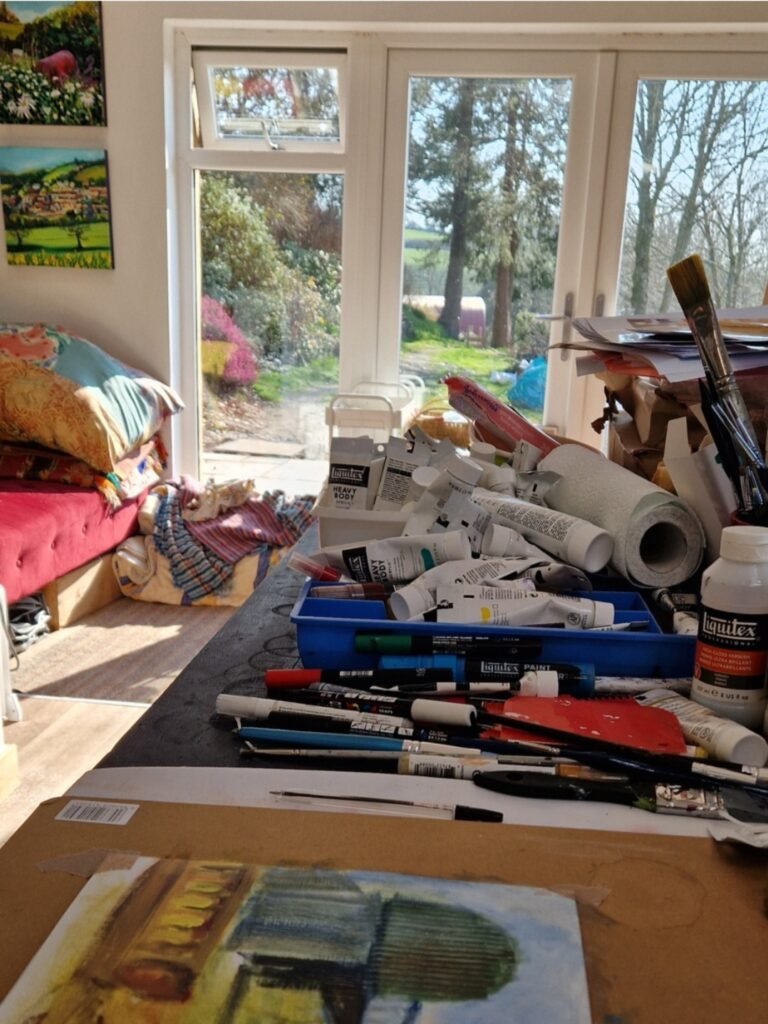 Artist workspace where Sue Dewhurst creates paintings inspired by British life.
