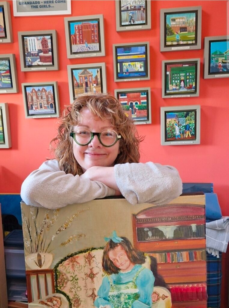 Owd Lasses paintings and colourful artwork inside the artist's studio.
