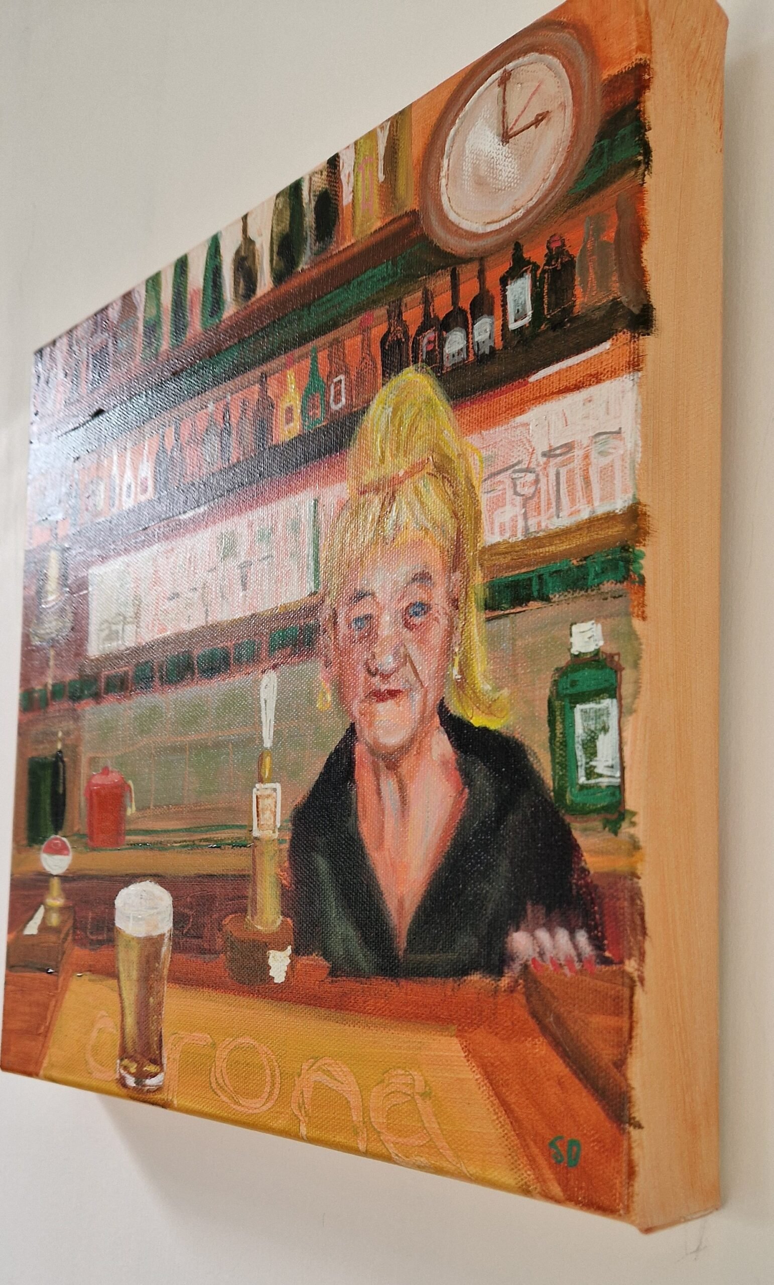 Side view of The Barmaid original figurative painting by Sue Dewhurst showing the canvas depth and finish