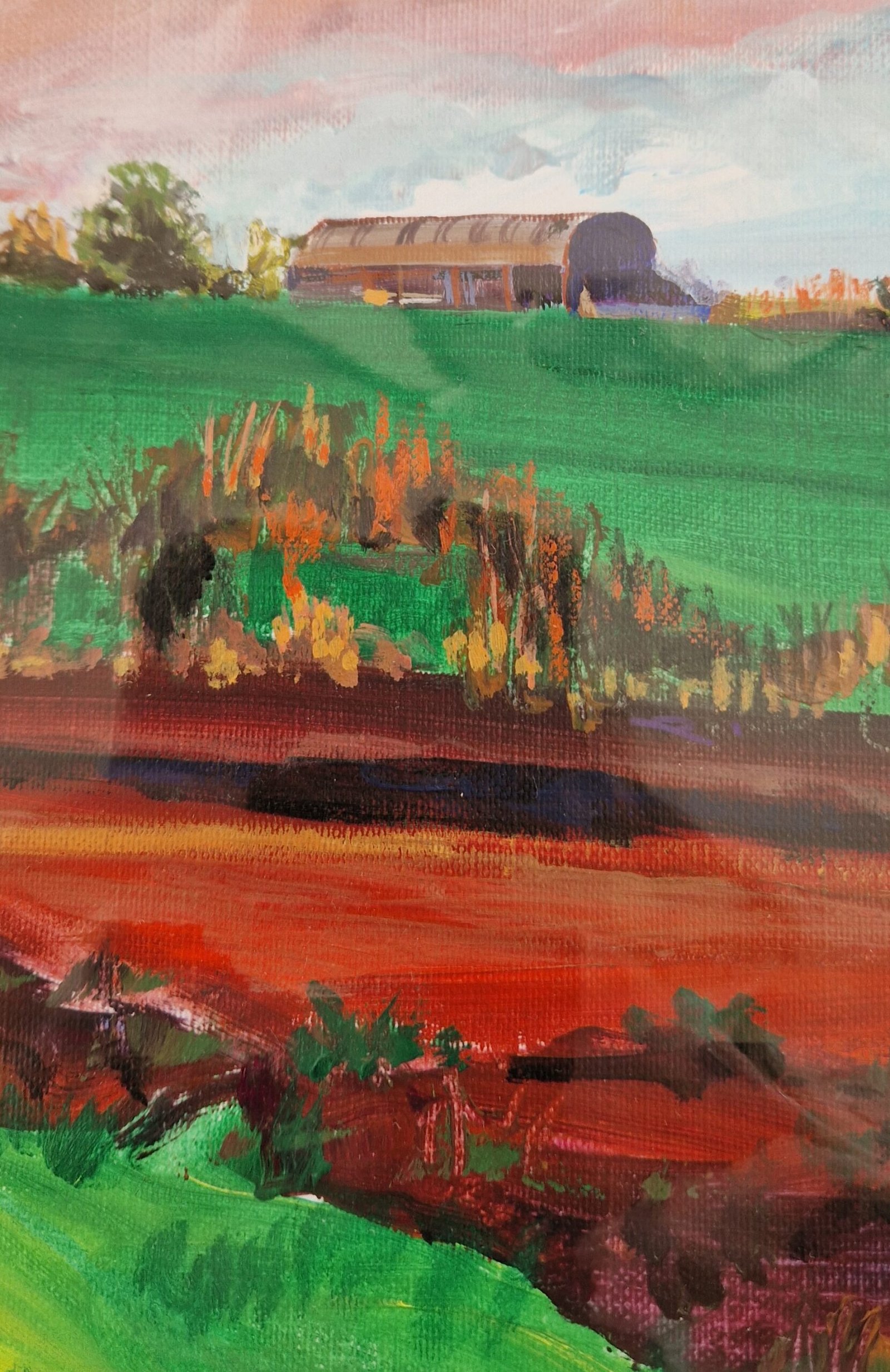 Close-up of Barn with Red Field by Sue Dewhurst showing expressive red brushwork, layered green fields and textured mixed-media marks.