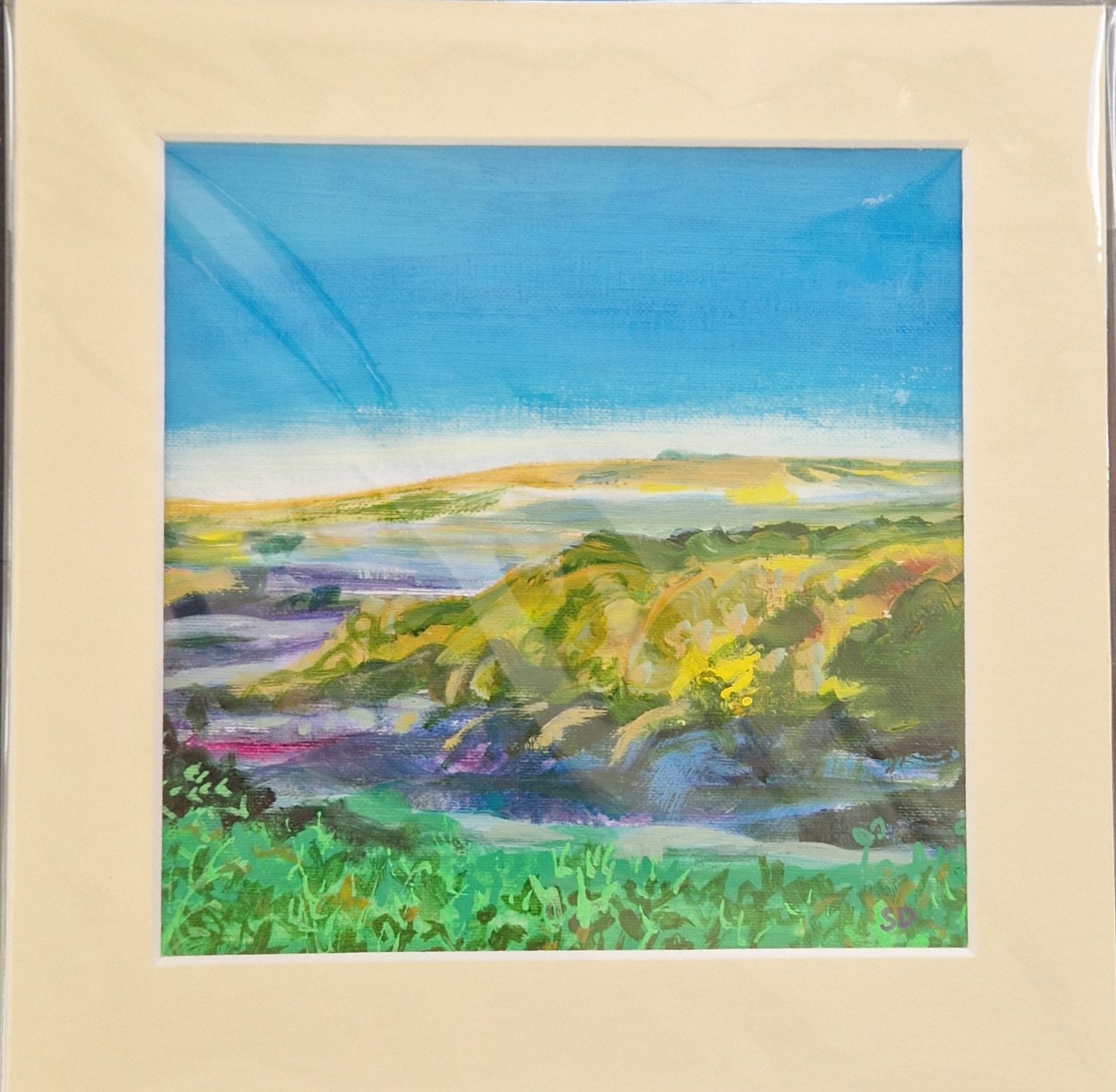 Mellow Hills original mixed media landscape by Sue Dewhurst showing rolling green and golden hills beneath a broad blue sky.