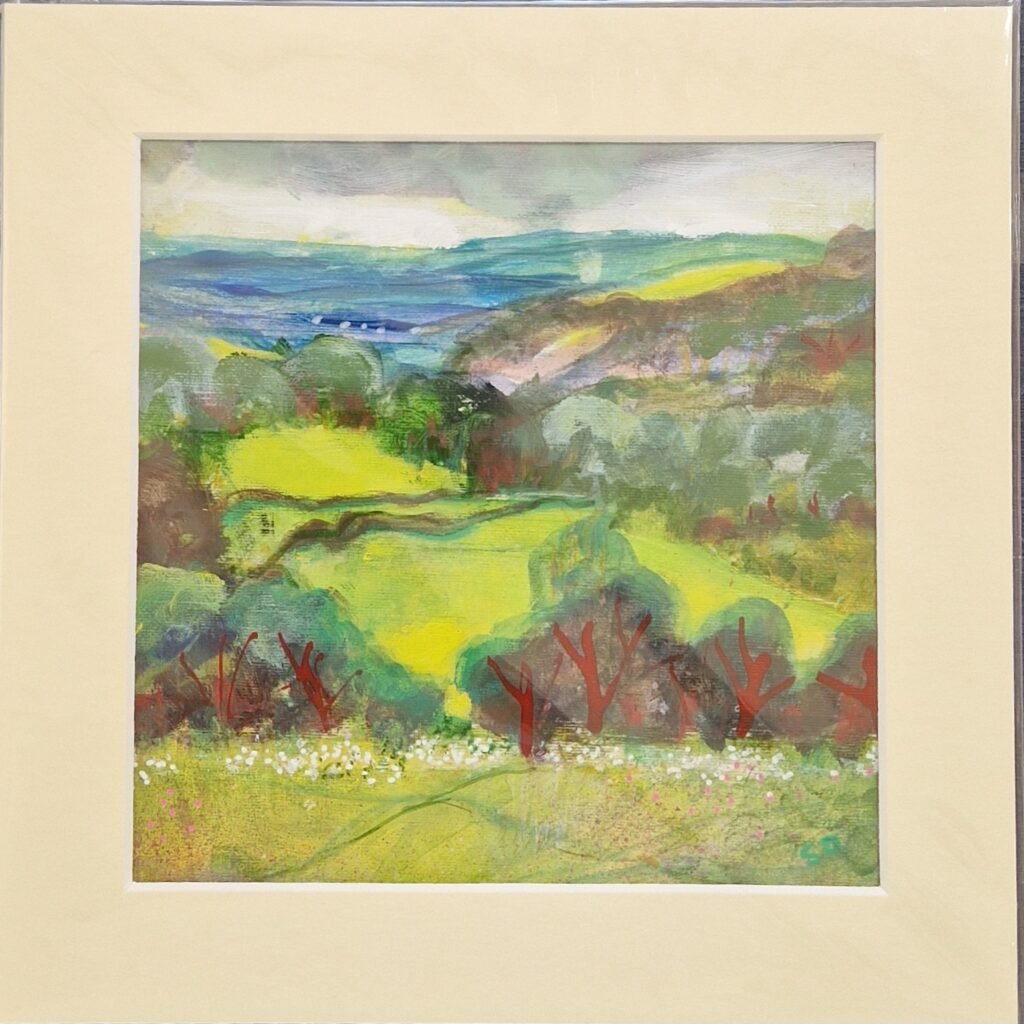 Storm Incoming original mixed media landscape by Sue Dewhurst showing vivid green fields, distant blue hills and trees beneath gathering storm clouds.